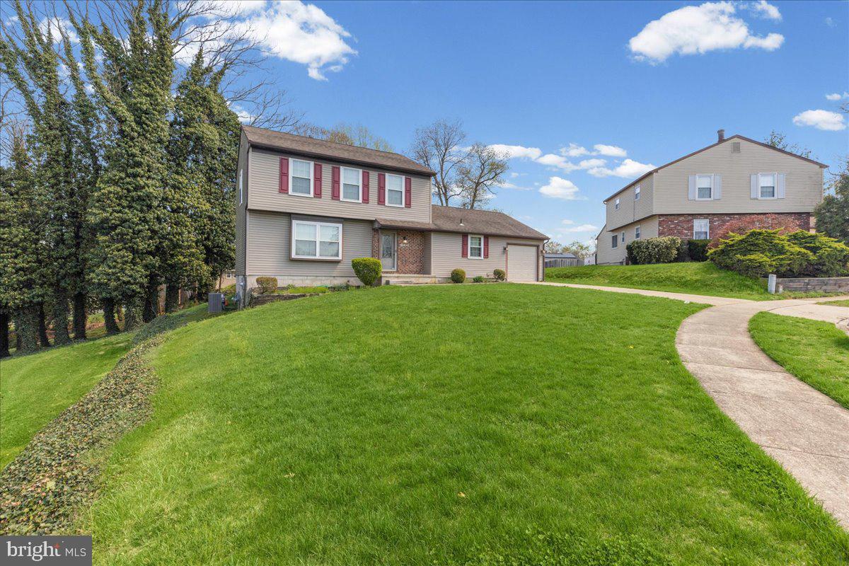 1795 Witherspoon Court Sewell, NJ 08080 - Photo 3 of 32 a view of a big house with a big yard and large trees