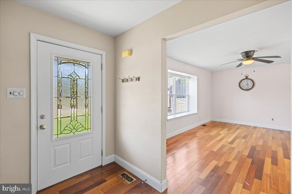 1795 Witherspoon Court Sewell, NJ 08080 - Photo 4 of 32 a view of an empty room with window and wooden floor