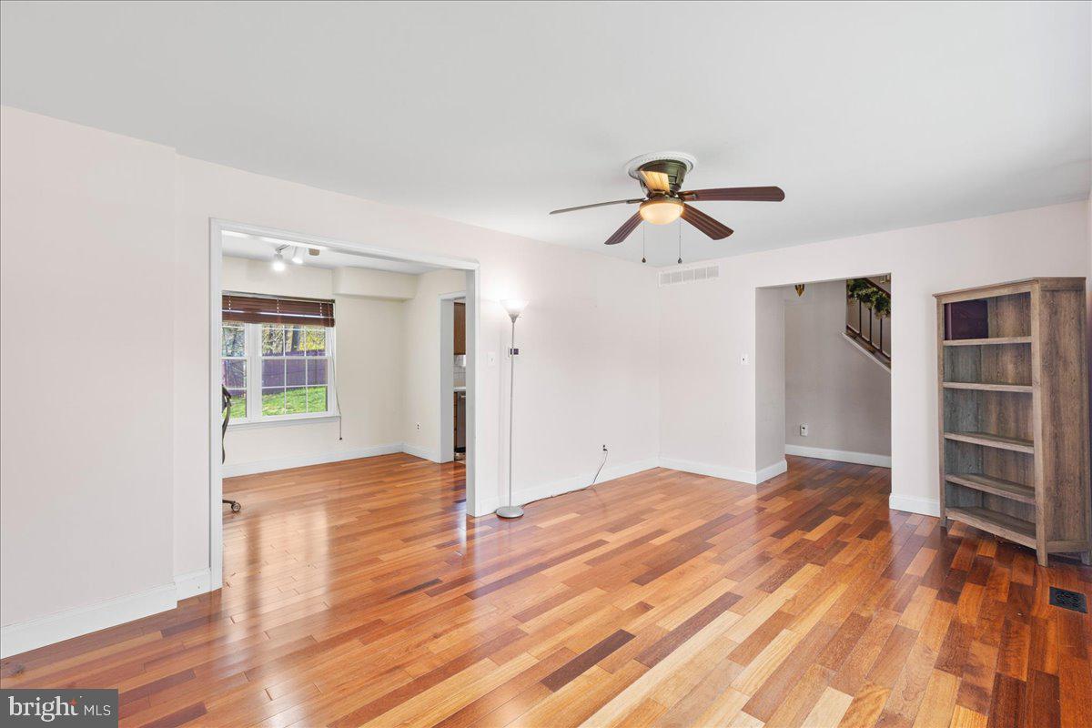 1795 Witherspoon Court Sewell, NJ 08080 - Photo 7 of 32 a view of empty room with wooden floor and fan