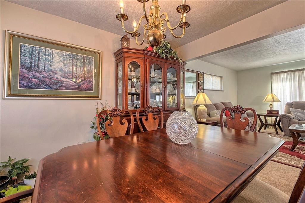 545 Greenridge Road New Kensington, PA 15068 - Photo 11 of 28 a view of a dining room with furniture window and wooden floor