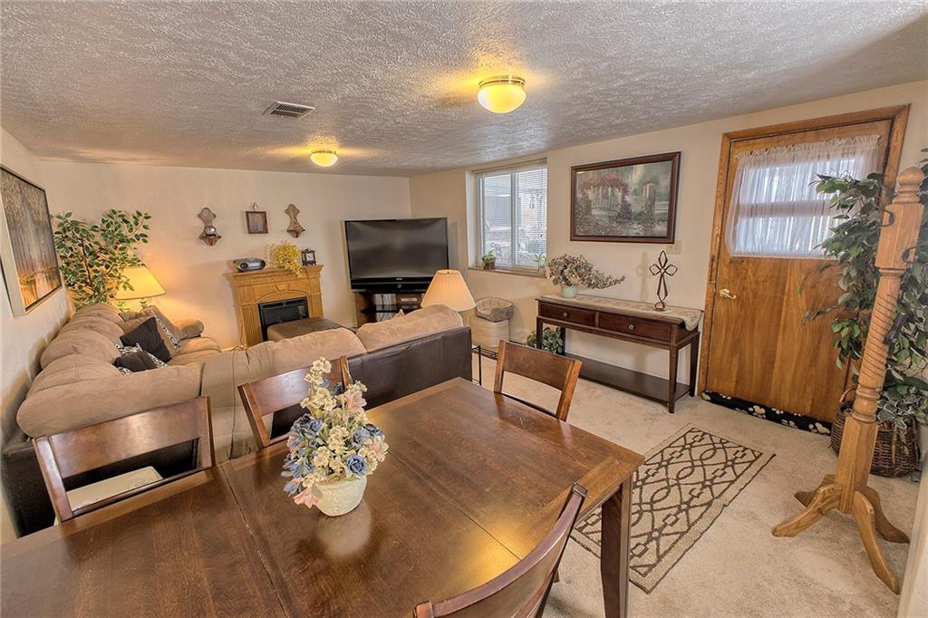 545 Greenridge Road New Kensington, PA 15068 - Photo 13 of 28 a living room with furniture and a flat screen tv