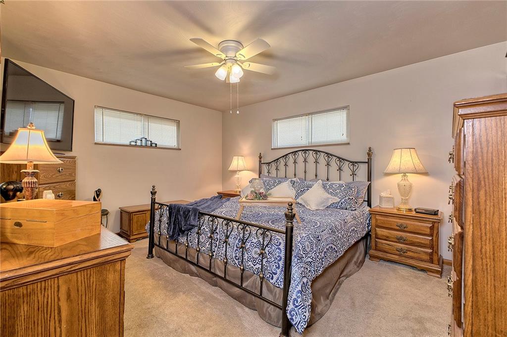 545 Greenridge Road New Kensington, PA 15068 - Photo 16 of 28 a bedroom with a bed and a chandelier