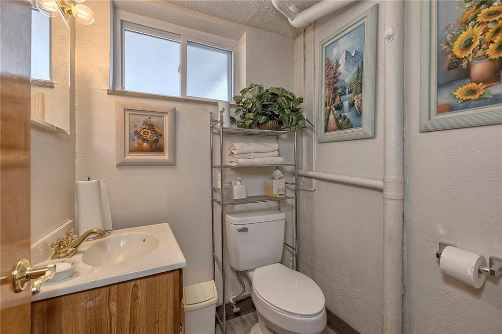 545 Greenridge Road New Kensington, PA 15068 - Photo 21 of 28 a bathroom with a toilet a sink and mirror