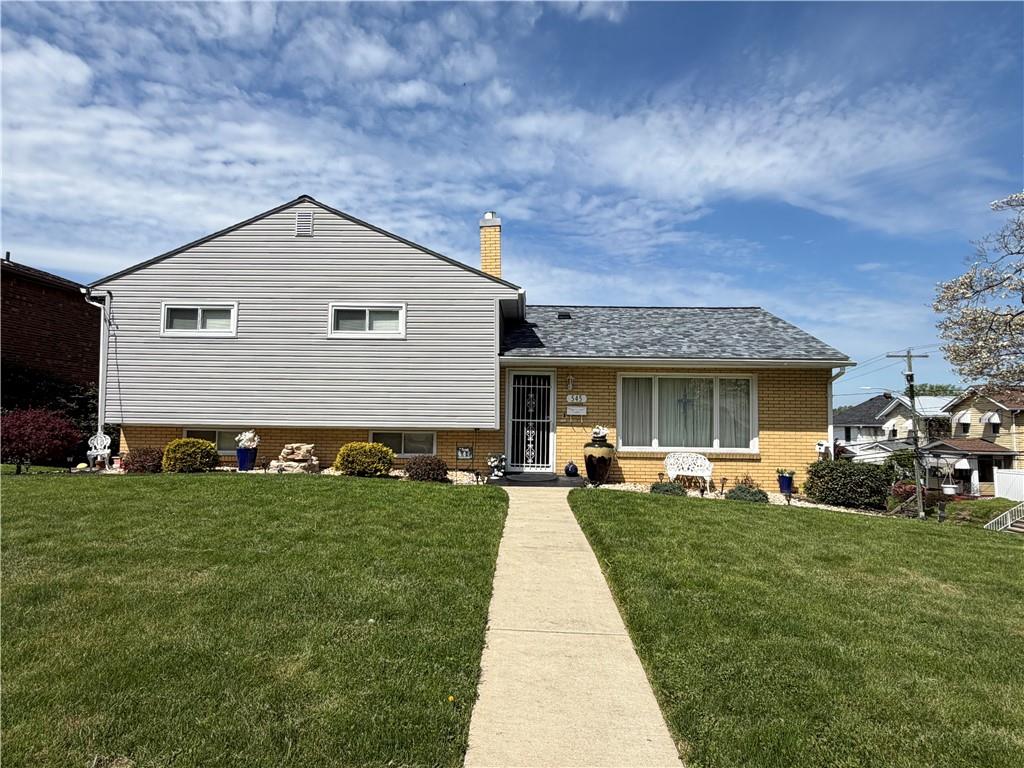 545 Greenridge Road New Kensington, PA 15068 - Photo 28 of 28 a front view of a house with a garden and trees