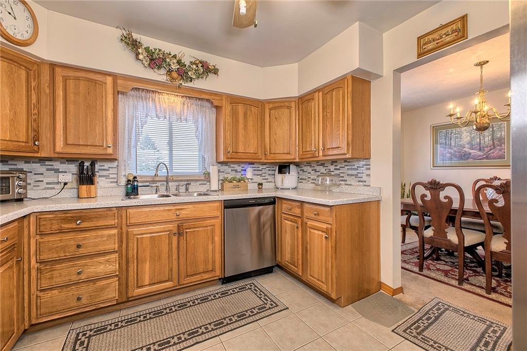 545 Greenridge Road New Kensington, PA 15068 - Photo 3 of 28 a kitchen with stainless steel appliances granite countertop a stove a sink and a refrigerator