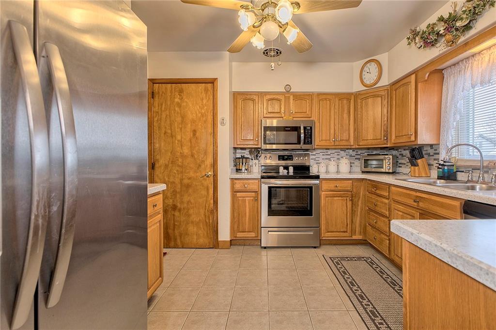 545 Greenridge Road New Kensington, PA 15068 - Photo 5 of 28 a kitchen with stainless steel appliances a refrigerator sink and microwave
