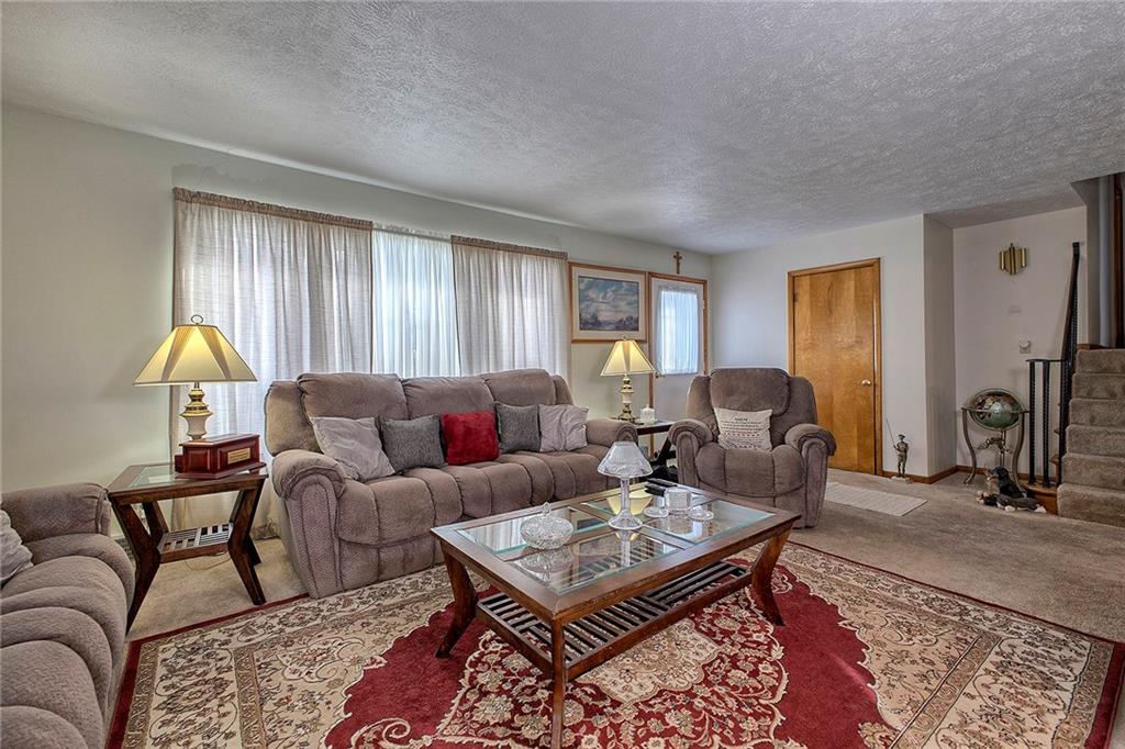 545 Greenridge Road New Kensington, PA 15068 - Photo 7 of 28 a living room with furniture a rug and a window