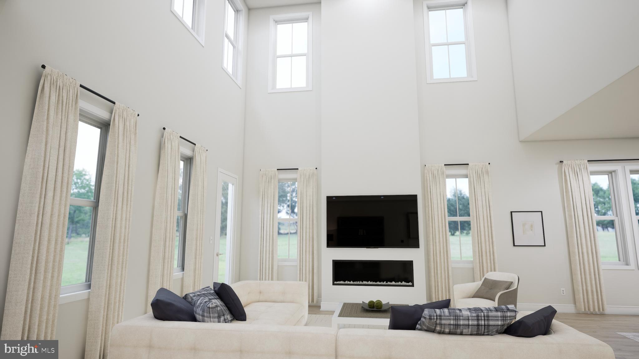 25611 Red Cherry Drive Aldie, VA 20105 - Photo 11 of 26 a living room with furniture and a flat screen tv