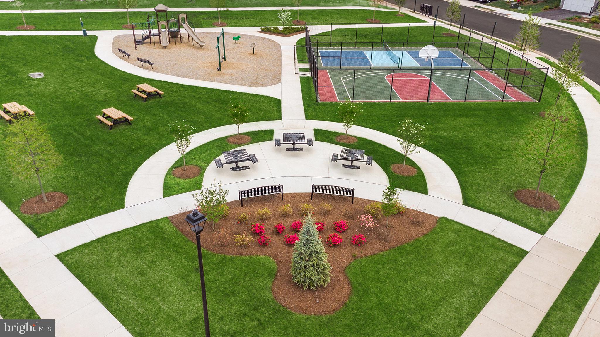 25611 Red Cherry Drive Aldie, VA 20105 - Photo 22 of 26 a view of a table and chairs in the garden