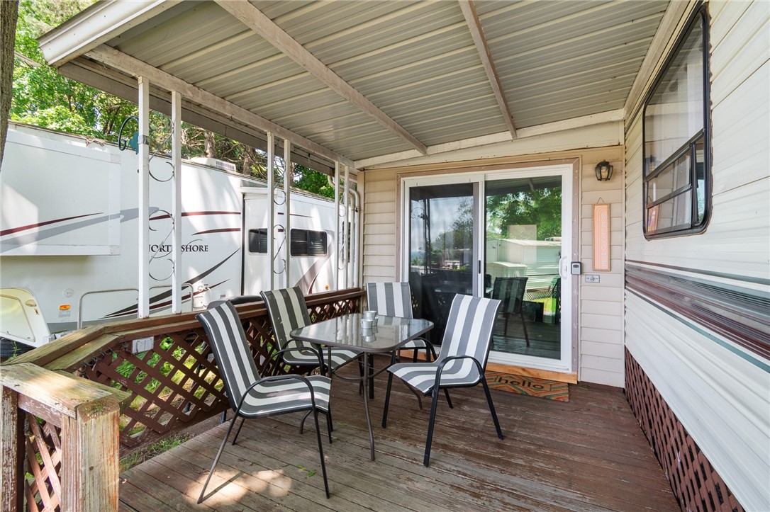 7945 Lake Road, Unit 129 Sodus, NY 14555 - Photo 7 of 22 The shaded deck area- a peaceful retreat from everyday life!