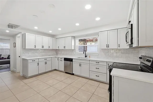 a bedroom with furniture and windows