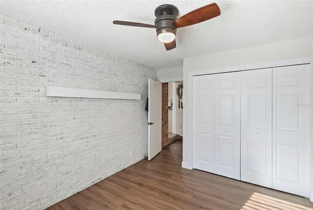 a bedroom with furniture and a large mirror