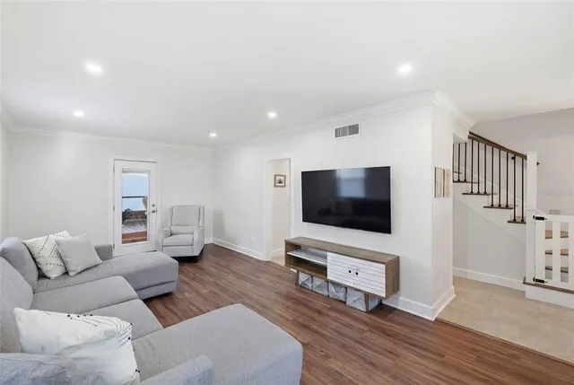 a bathroom with a toilet a sink a mirror and vanity