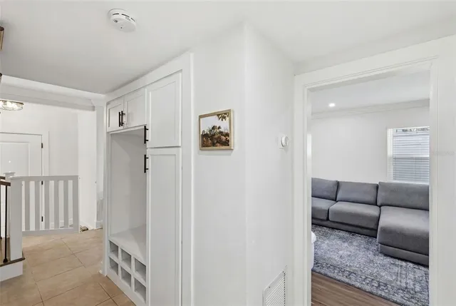a kitchen that has a lot of cabinets in it and white appliances