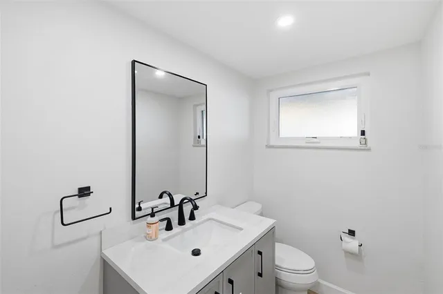 a dining room with furniture and a window