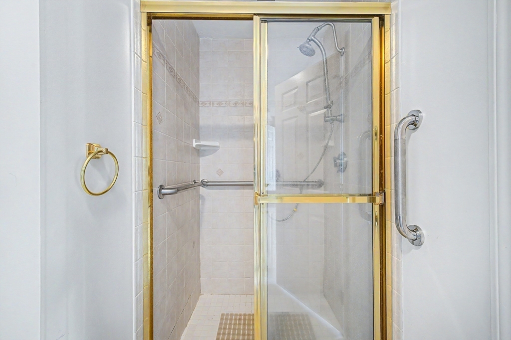 3 Oak View Terrace, Unit 3 Franklin, MA 02038 - Photo 15 of 38 a bathroom with a glass shower door
