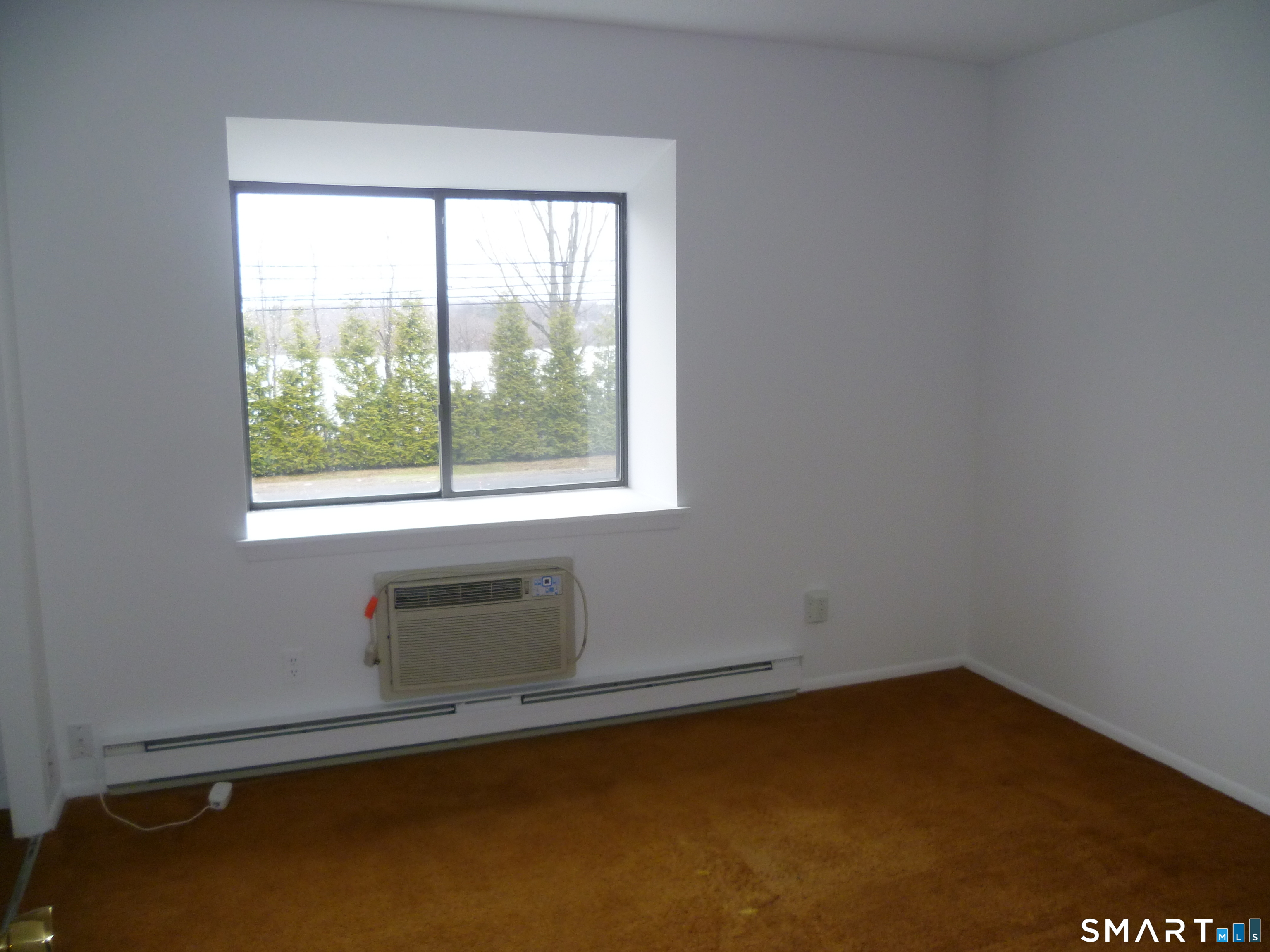 560 Yale Avenue, Unit 4 Meriden, CT 06450 - Photo 6 of 8 an empty room with a window