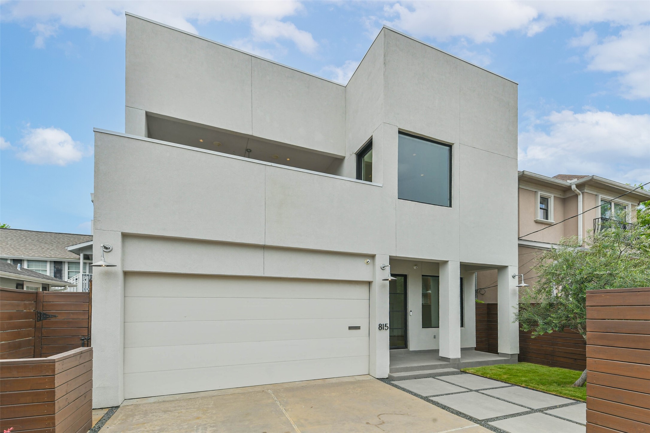 815 Alexander Street Houston, TX 77007 - Photo 2 of 49 Contemporary front elevation showcasing clean architectural lines, and a private gated courtyard that creates exceptional curb appeal