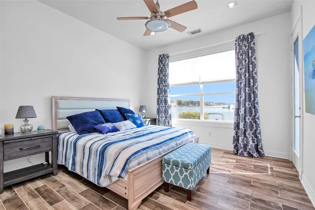 a bedroom with a bed and window