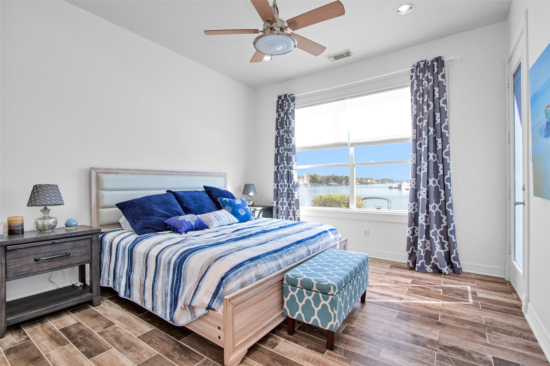 168 Lake Point Boulevard Conroe, TX 77356 - Photo 11 of 24 a bedroom with a bed and window