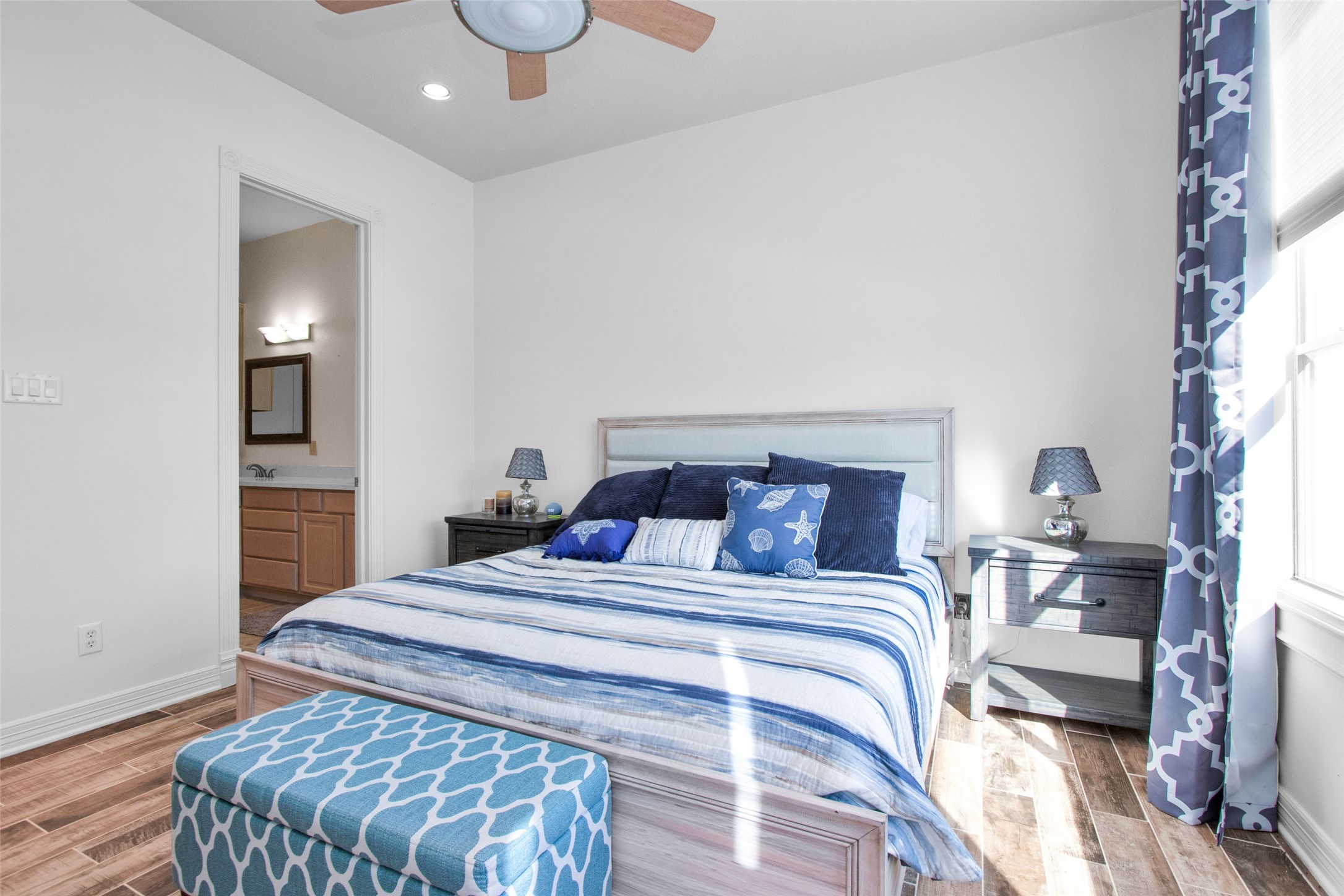 168 Lake Point Boulevard Conroe, TX 77356 - Photo 12 of 24 a bedroom with a bed and window