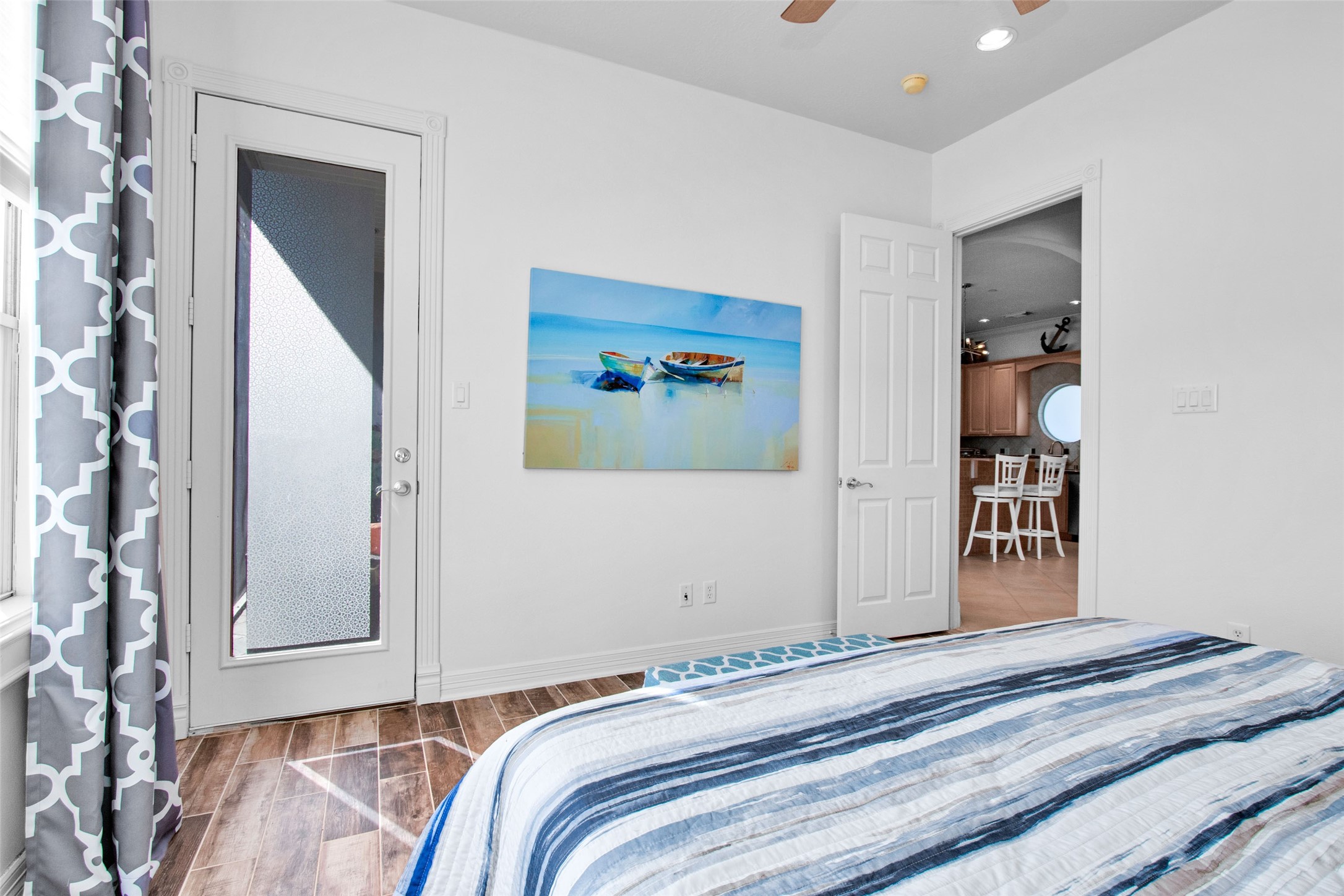 168 Lake Point Boulevard Conroe, TX 77356 - Photo 13 of 24 a bedroom with a bed and a painting on the wall