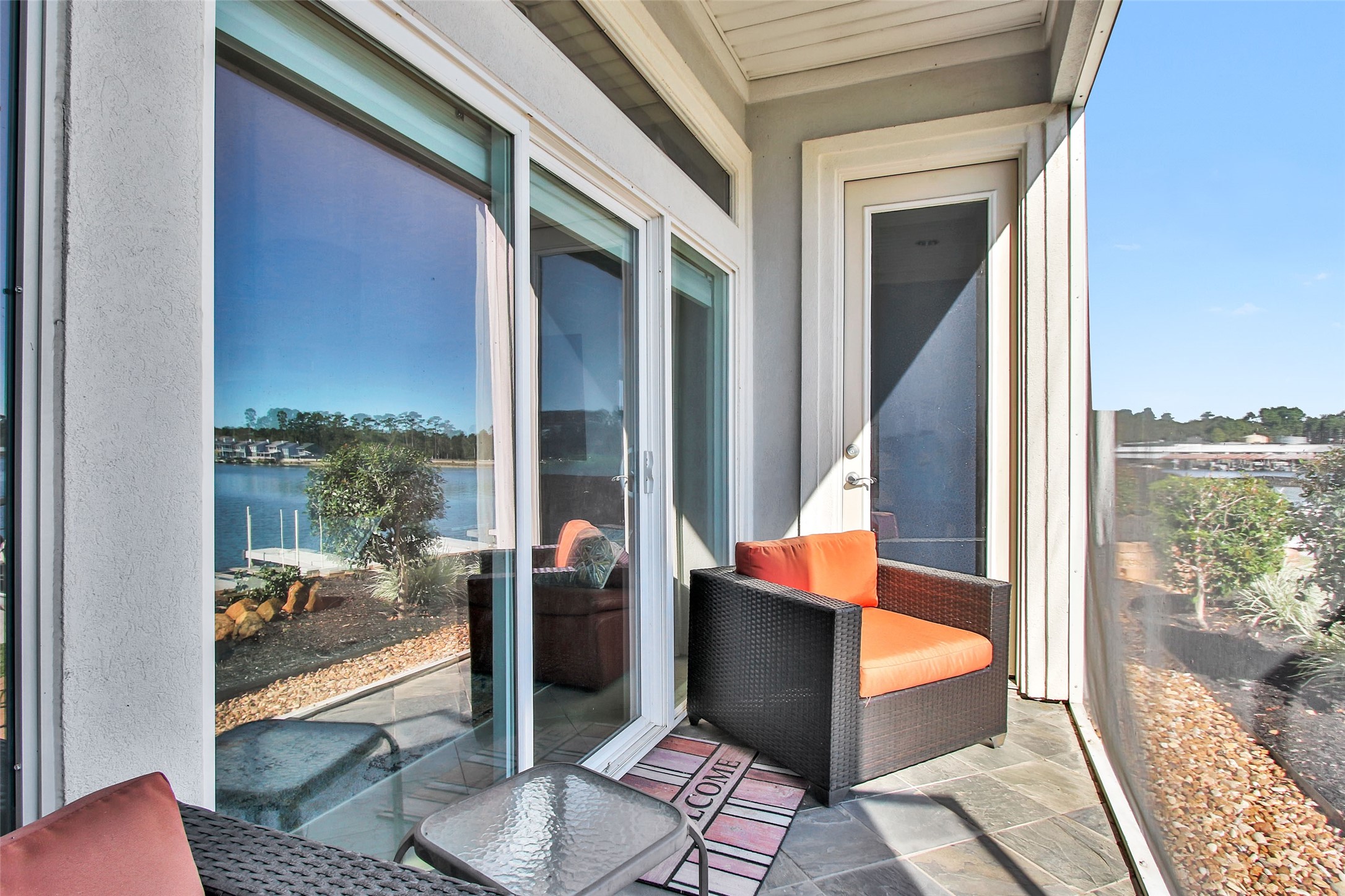 168 Lake Point Boulevard Conroe, TX 77356 - Photo 17 of 24 a outdoor space with patio the couch and glass door