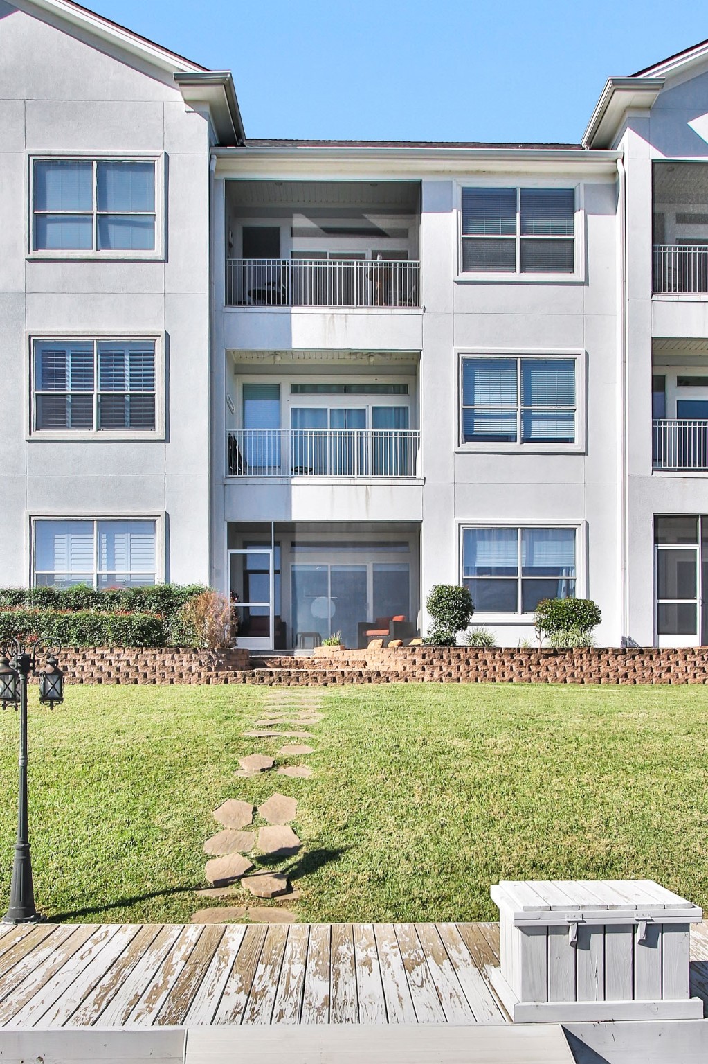 168 Lake Point Boulevard Conroe, TX 77356 - Photo 20 of 24 a view of a house with a yard