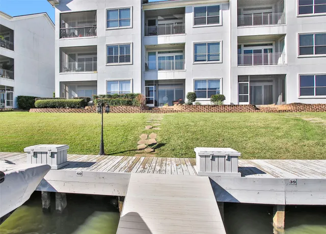 a view of a house with a yard from a patio