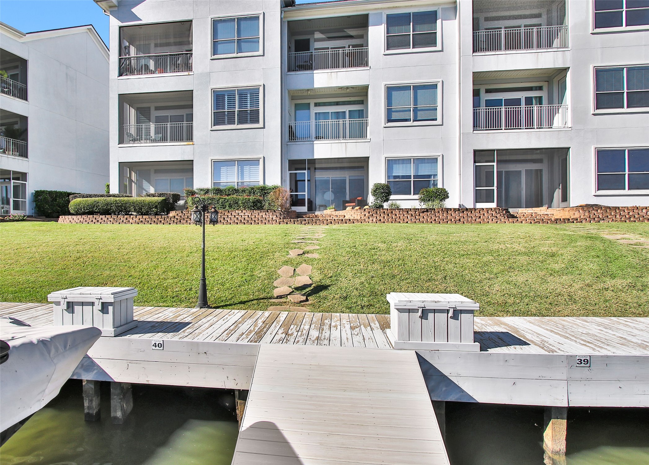 168 Lake Point Boulevard Conroe, TX 77356 - Photo 2 of 24 a view of a house with a yard from a patio