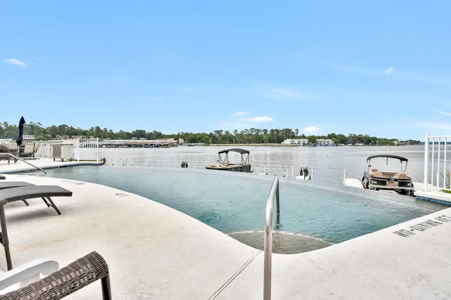 a view of a lake with couches and city view