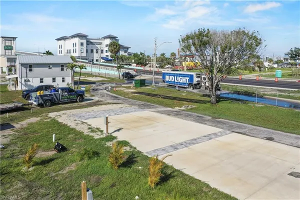 a view of multiple houses with a yard