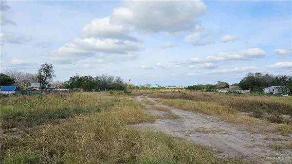 a view of lake with green space
