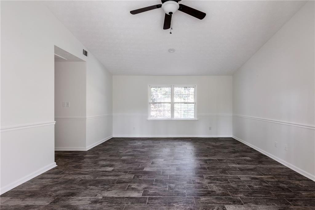143 Swanson Road Fayetteville, GA 30214 - Photo 19 of 27 wooden floor in an empty room with a window