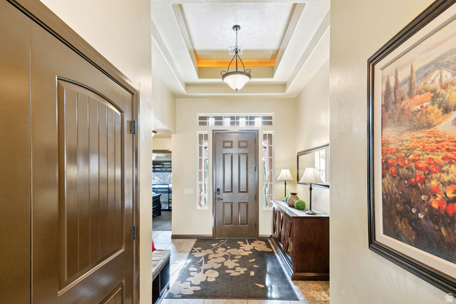 210 Talon Court Ivins, UT 84738 - Photo 7 of 60 Foyer with a tray ceiling and healthy amount of natural light