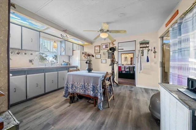 a very nice looking room with a large window and furniture