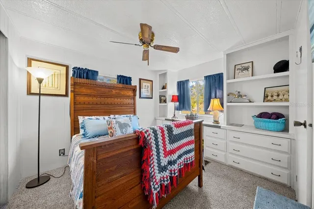 a bedroom with a bed and furniture