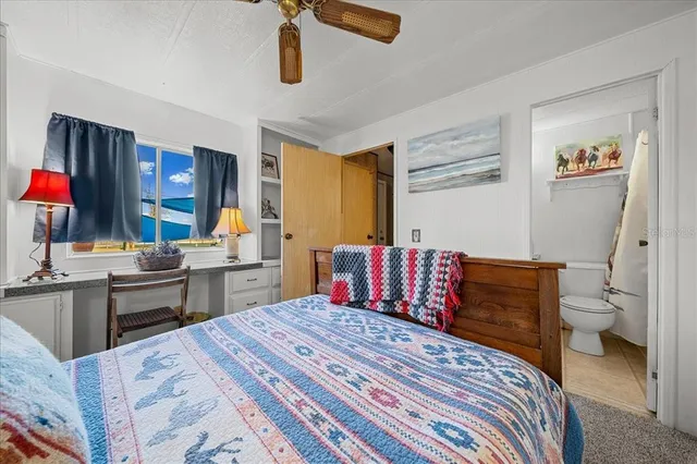 a bedroom with a bed and furniture