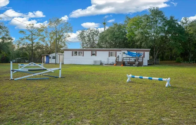 a view of a house with swimming pool