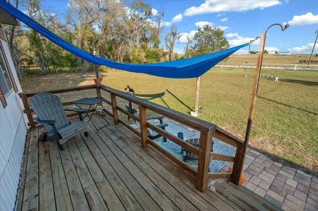 a view of a balcony with chairs