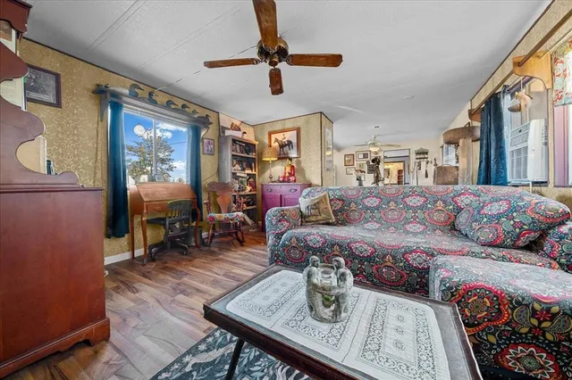 a living room with furniture and a window