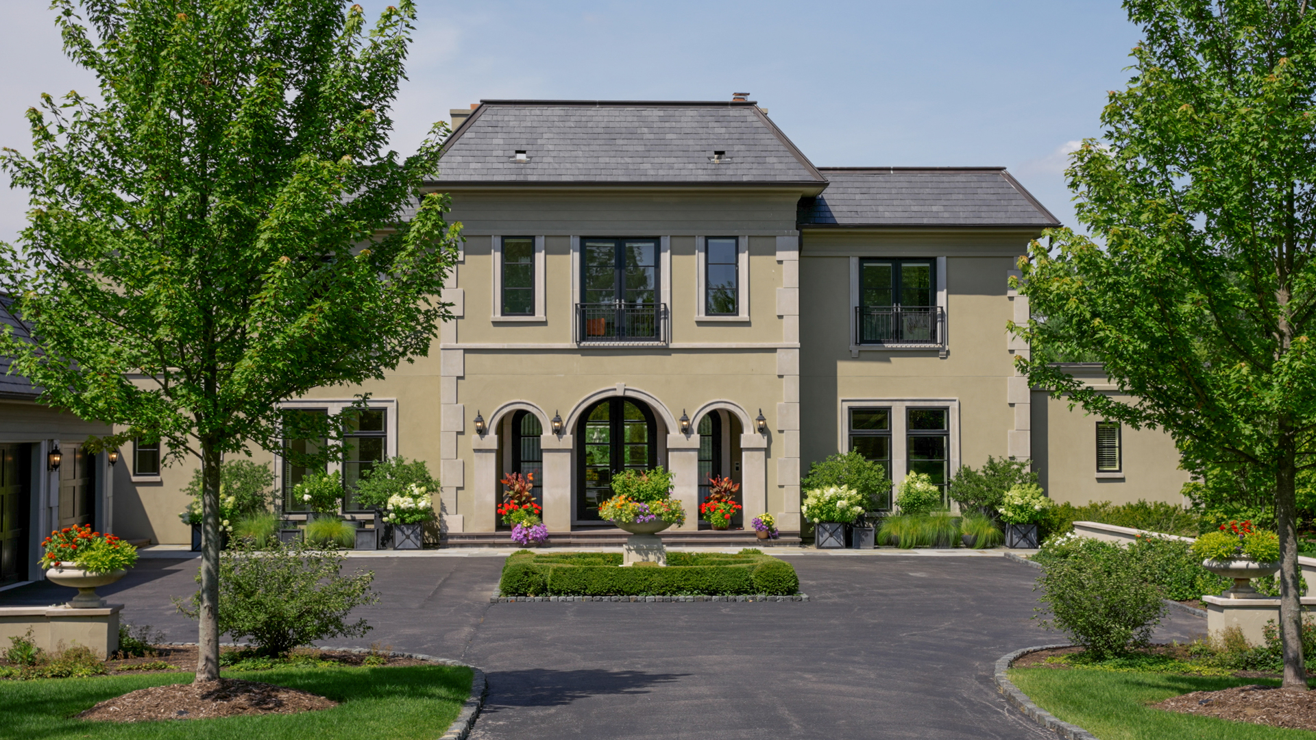 530 South Ridge Road Lake Forest, IL 60045 - Photo 1 of 46 a view of a white house with plants and large tree