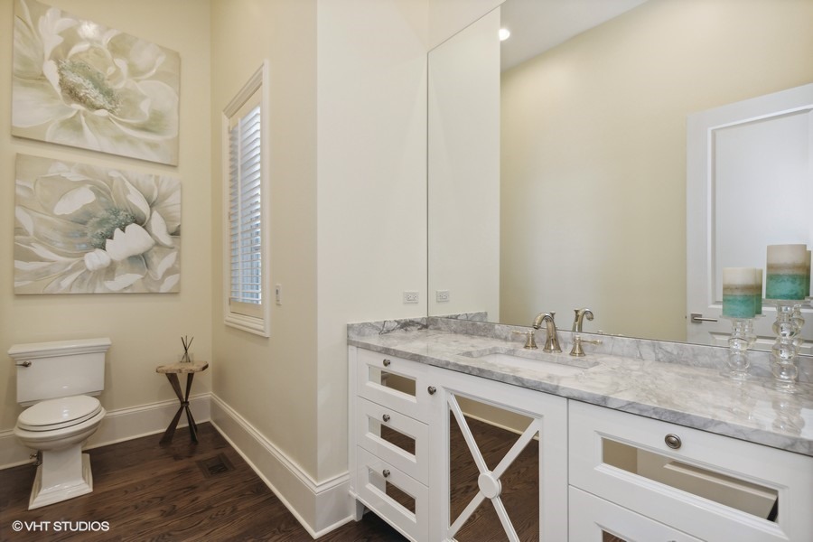 530 South Ridge Road Lake Forest, IL 60045 - Photo 13 of 46 a bathroom with a granite countertop toilet sink and mirror