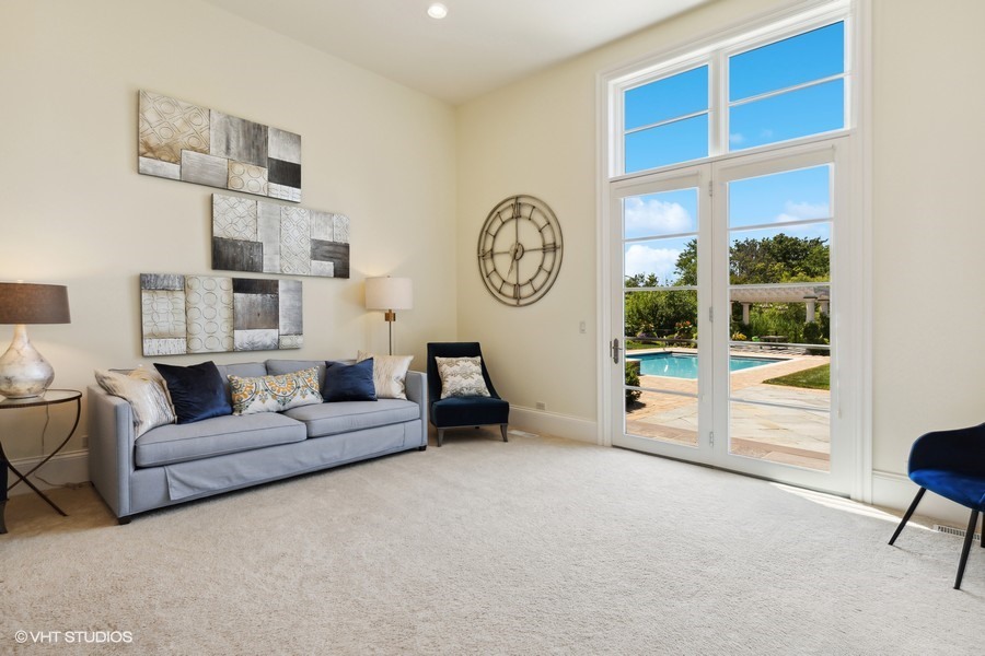 530 South Ridge Road Lake Forest, IL 60045 - Photo 14 of 46 a living room with furniture a large window and a clock