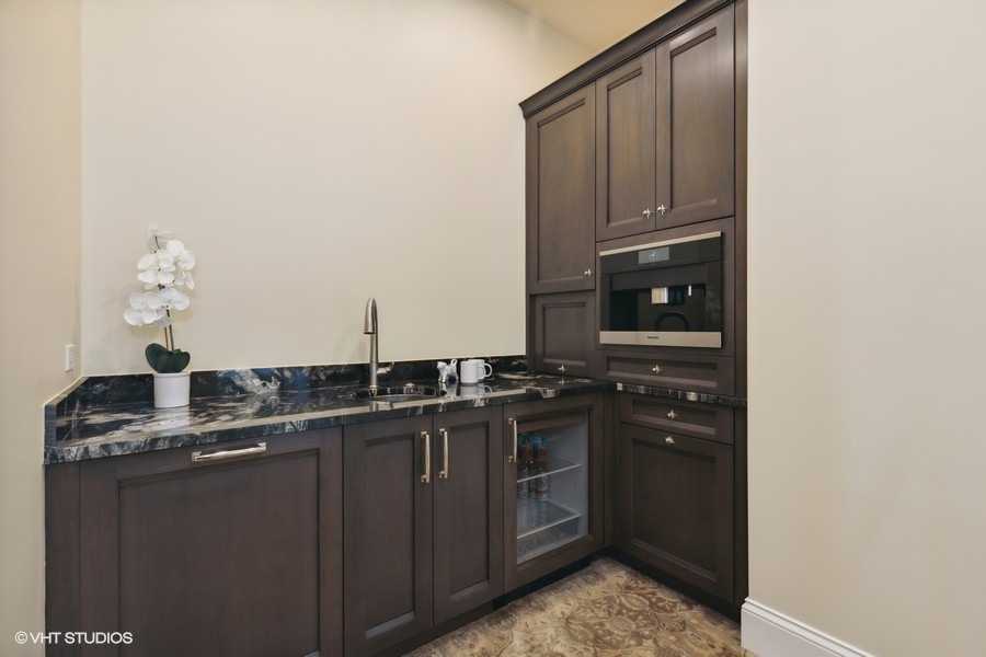 530 South Ridge Road Lake Forest, IL 60045 - Photo 23 of 46 a kitchen with a sink and cabinets
