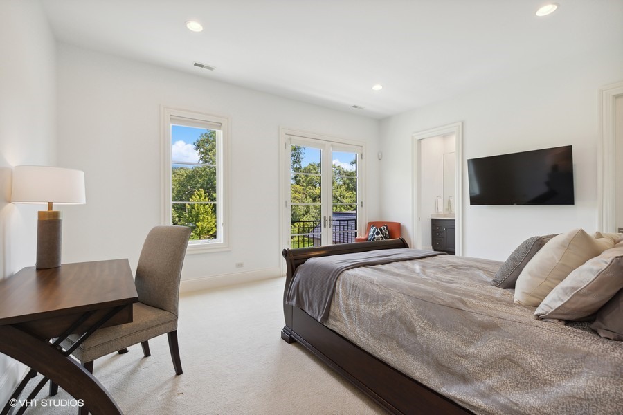 530 South Ridge Road Lake Forest, IL 60045 - Photo 27 of 46 a bedroom with a bed tv and window