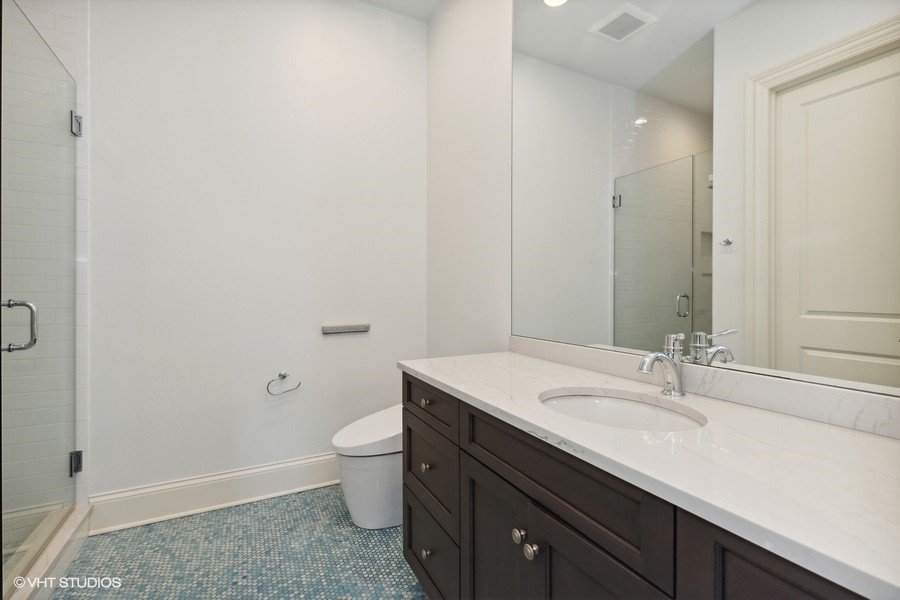 530 South Ridge Road Lake Forest, IL 60045 - Photo 29 of 46 a bathroom with a sink a toilet a shower and a mirror