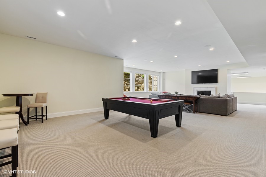 530 South Ridge Road Lake Forest, IL 60045 - Photo 33 of 46 a living room with furniture and a flat screen tv