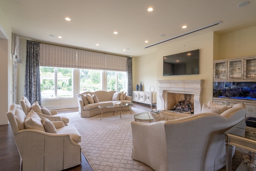 530 South Ridge Road Lake Forest, IL 60045 - Photo 6 of 46 a living room with fireplace furniture and a flat screen tv