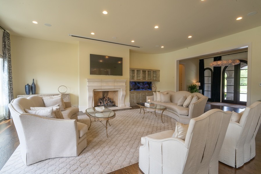 530 South Ridge Road Lake Forest, IL 60045 - Photo 7 of 46 a living room with furniture a flat screen tv and a fireplace